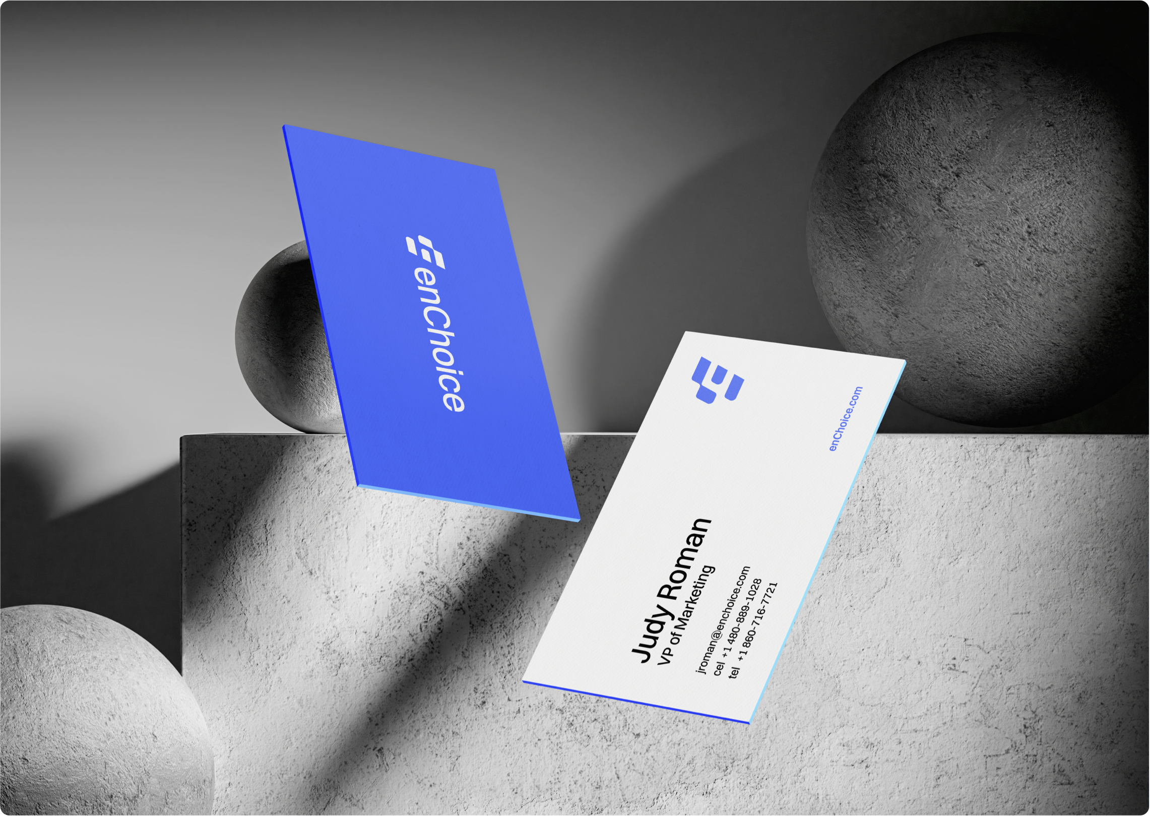 enChoice business cards on a textured stone surface